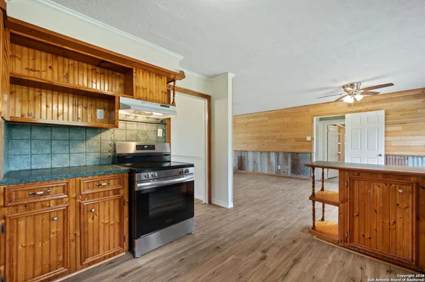 a kitchen with stainless steel appliances granite countertop a stove and a refrigerator