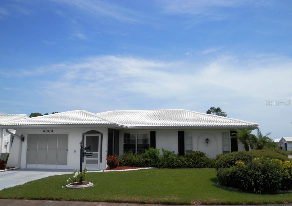 4004 Chinaberry Road Bradenton, FL 34208 - Photo 1 of 1 View at street level. Very nice landscape frontage.