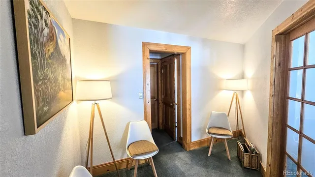 a bedroom with furniture and a potted plant