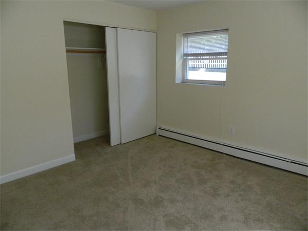 59 Prospect Street, Unit A4 Marblehead, MA 01945 - Photo 5 of 6 an empty room with a empty space and window
