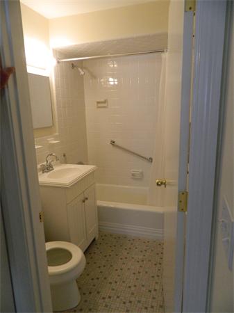 59 Prospect Street, Unit A4 Marblehead, MA 01945 - Photo 6 of 6 a bathroom with a sink a toilet and shower