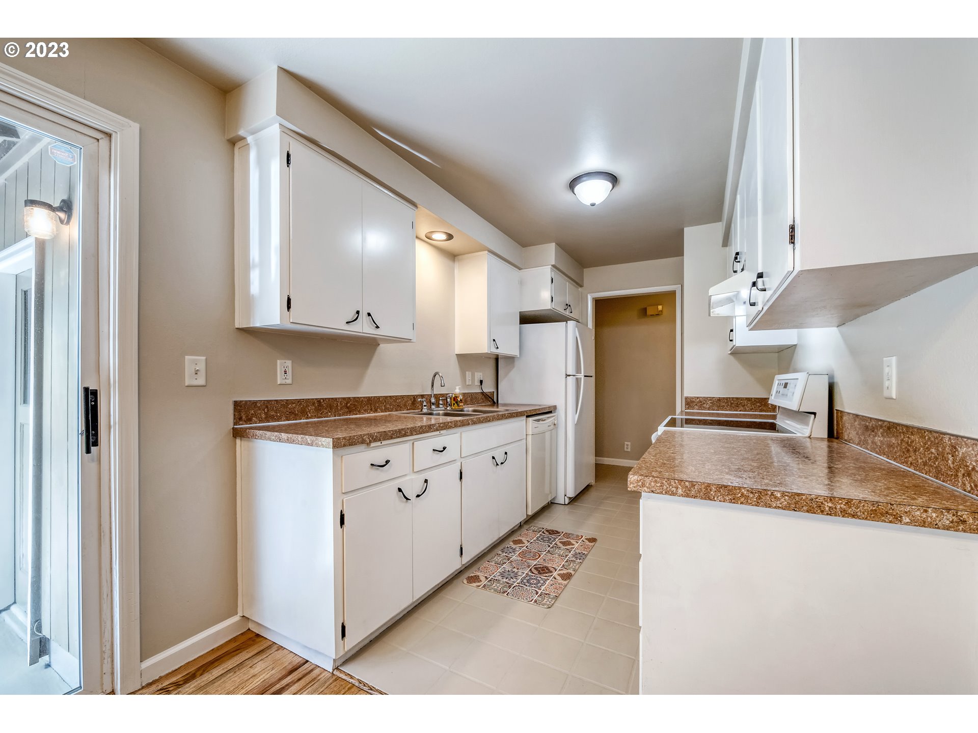 4439 Camellia Street Springfield, OR 97478 - Photo 14 of 31 a kitchen with granite countertop a sink stainless steel appliances and cabinets