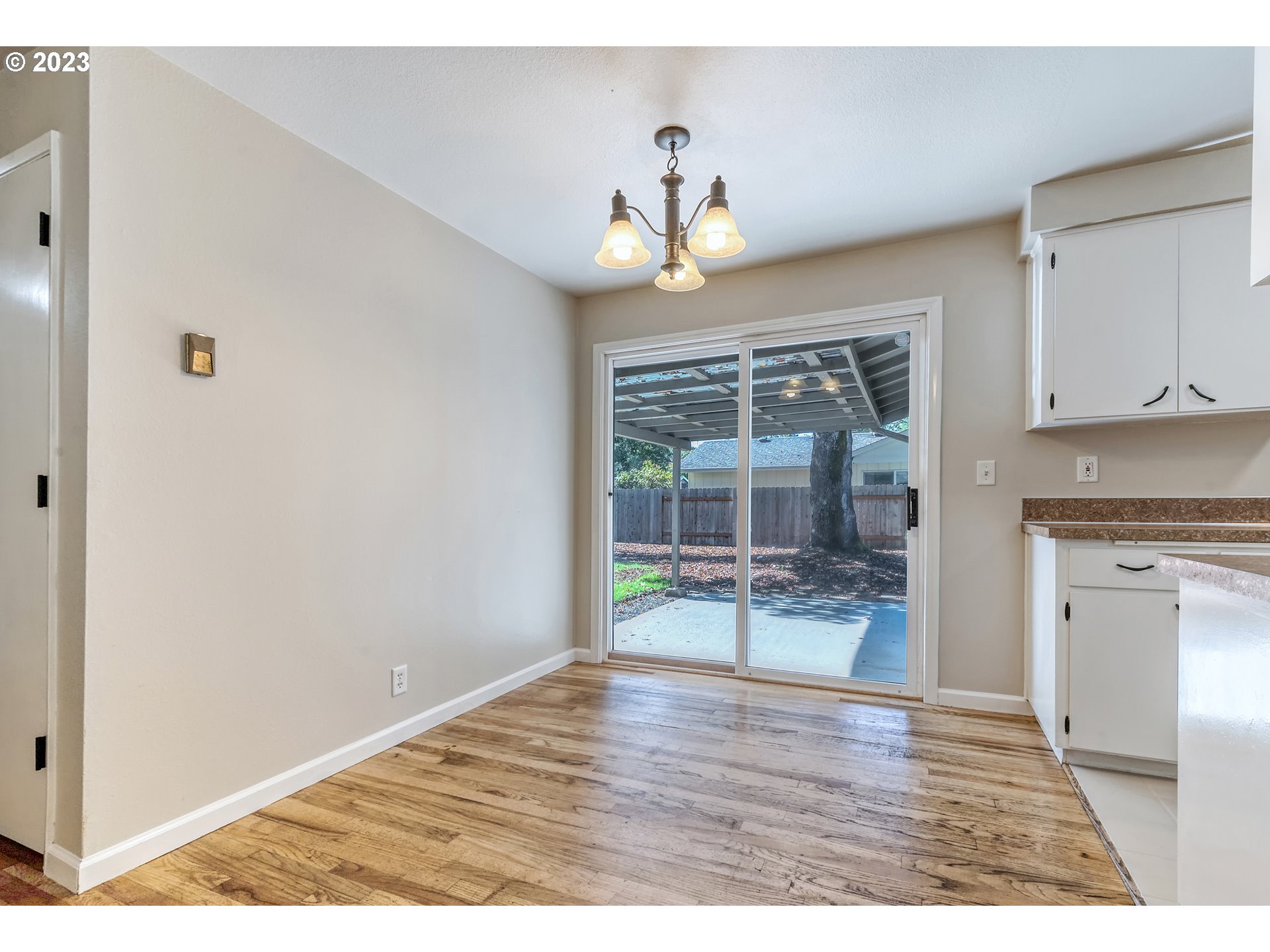 4439 Camellia Street Springfield, OR 97478 - Photo 16 of 31 a view of an empty room with a window and wooden floor