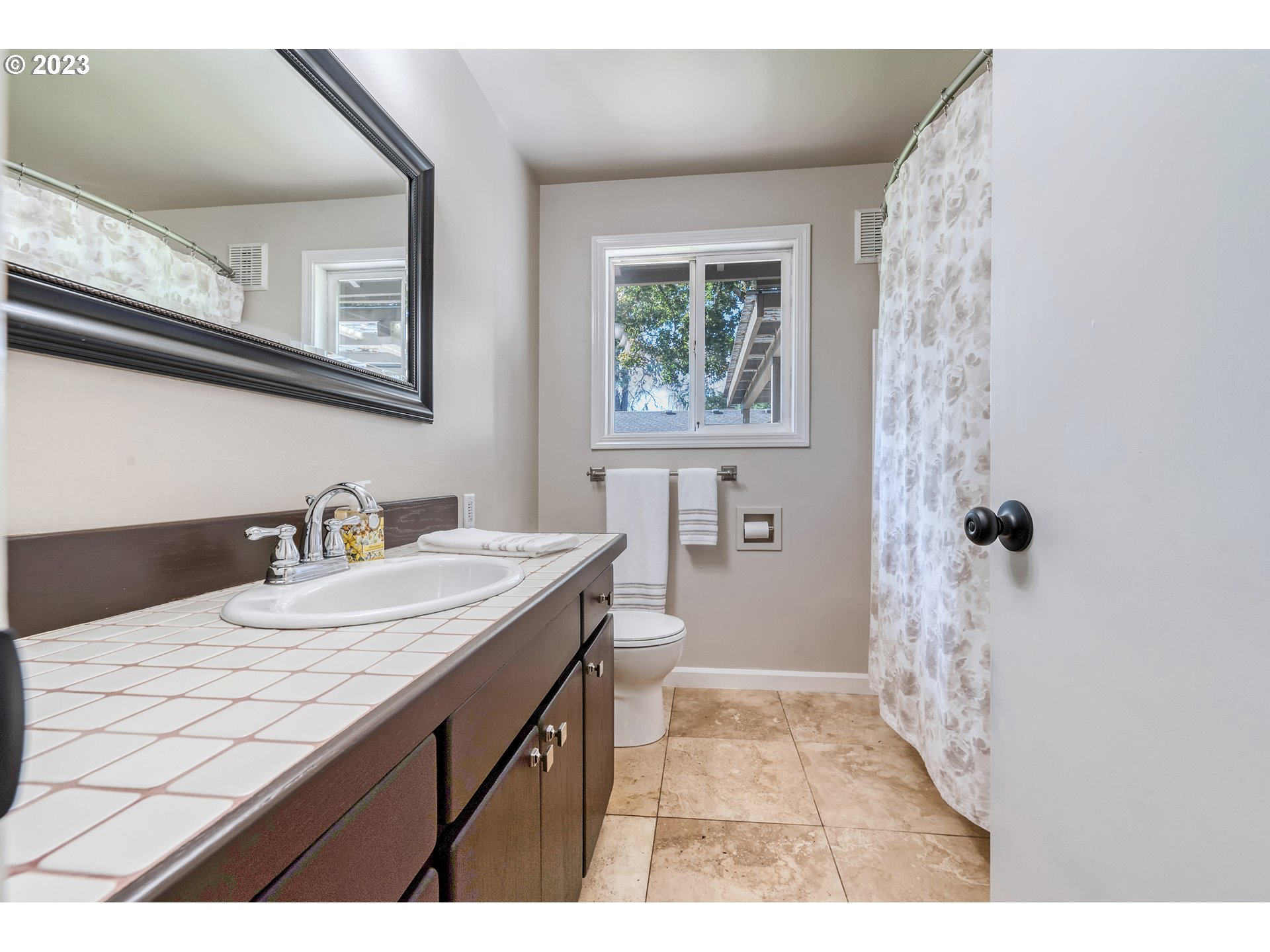 4439 Camellia Street Springfield, OR 97478 - Photo 18 of 31 a bathroom with a sink a toilet a shower and a mirror
