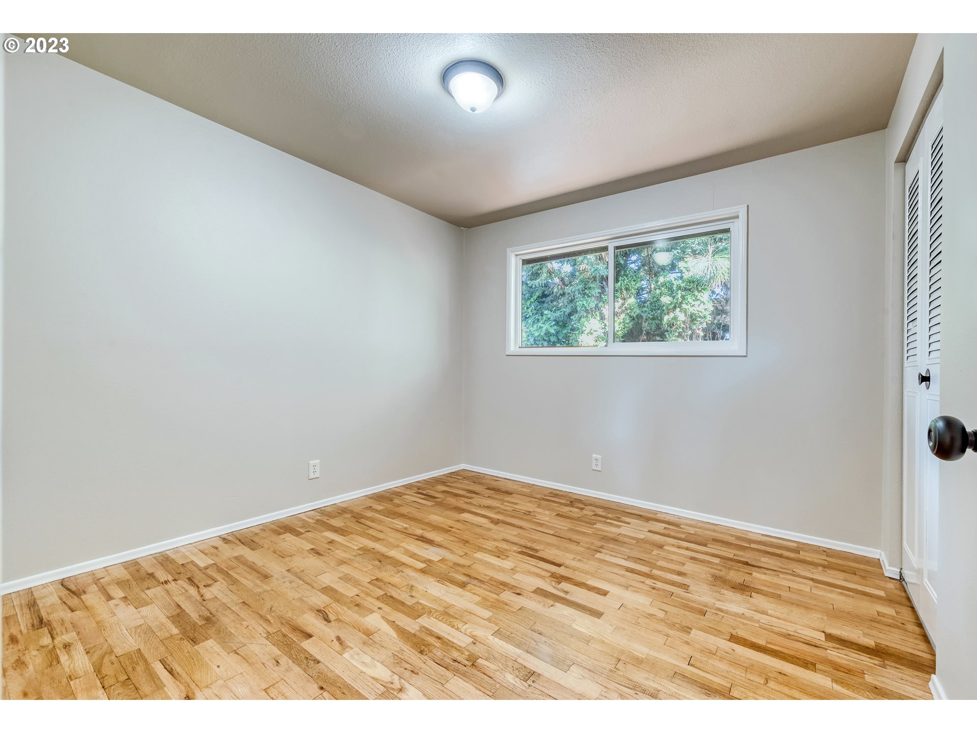 4439 Camellia Street Springfield, OR 97478 - Photo 19 of 31 a view of empty room with wooden floor