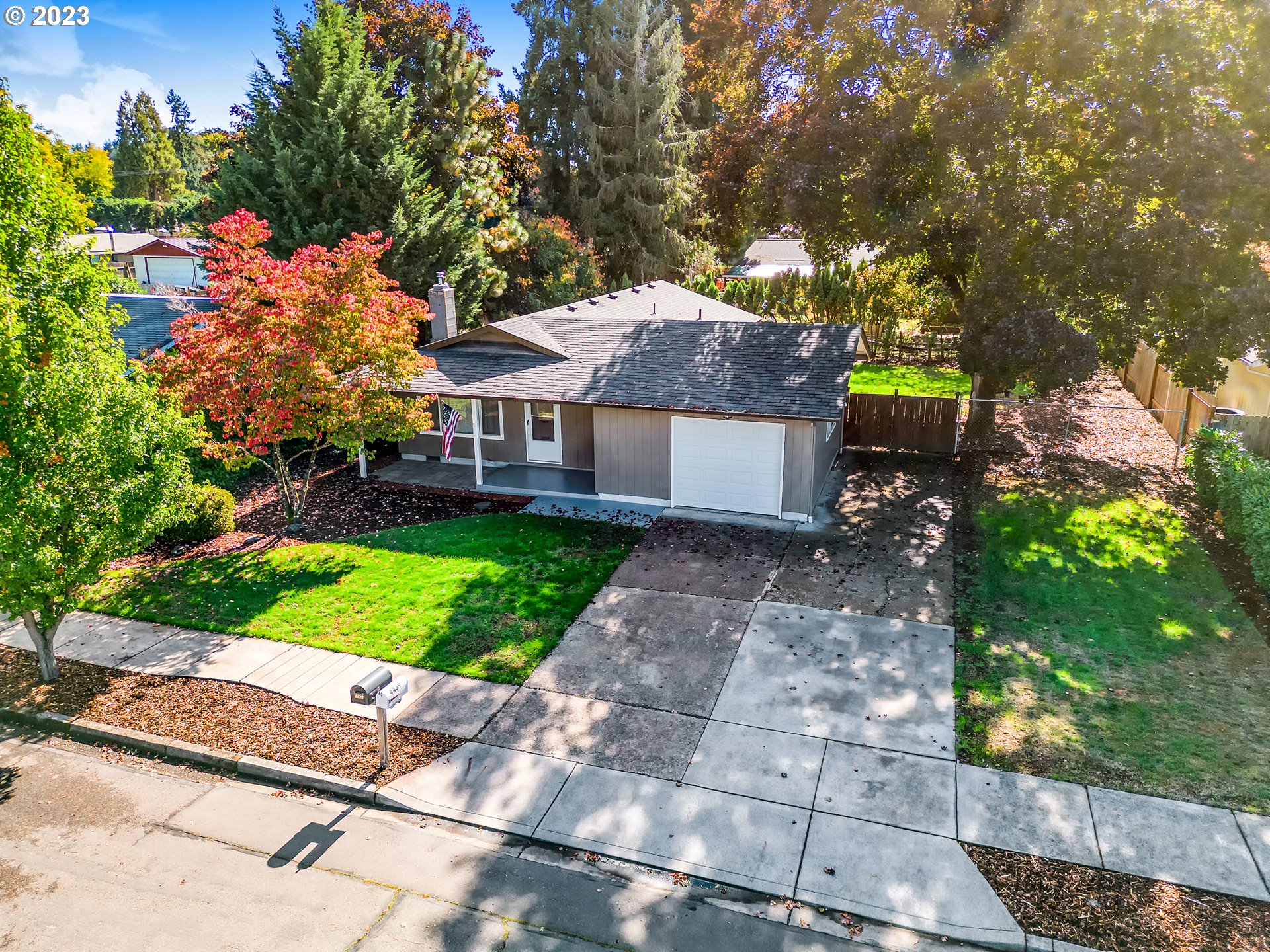 4439 Camellia Street Springfield, OR 97478 - Photo 3 of 31 a front view of a house with a yard and a garage