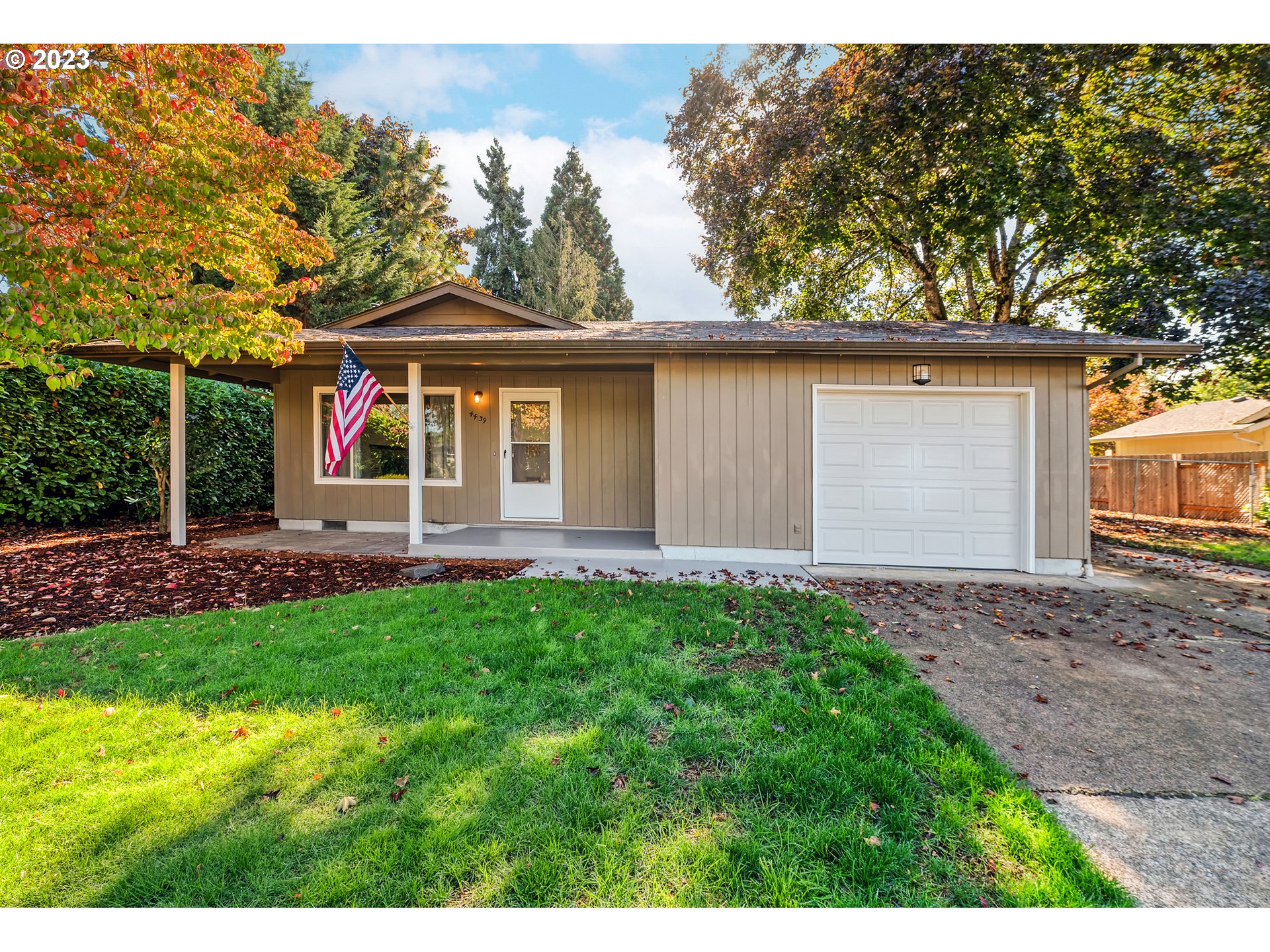 4439 Camellia Street Springfield, OR 97478 - Photo 6 of 31 a front view of a house with a yard and garage