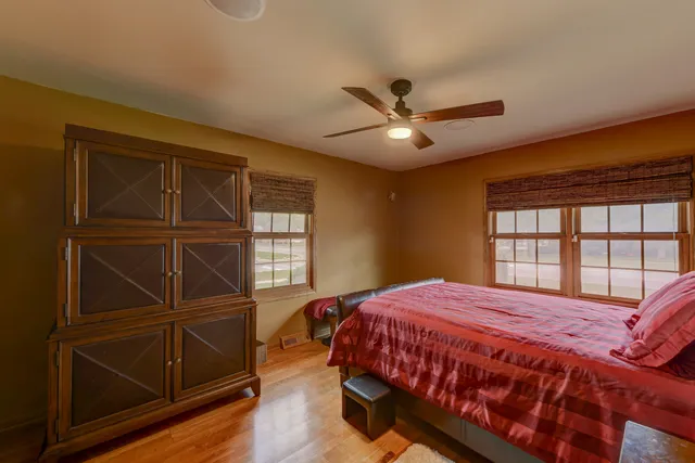 a bedroom with a bed window and a walk in closet