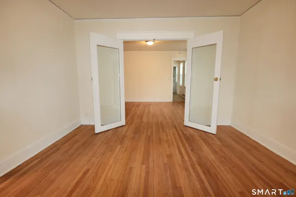a view of wooden floor in an empty room