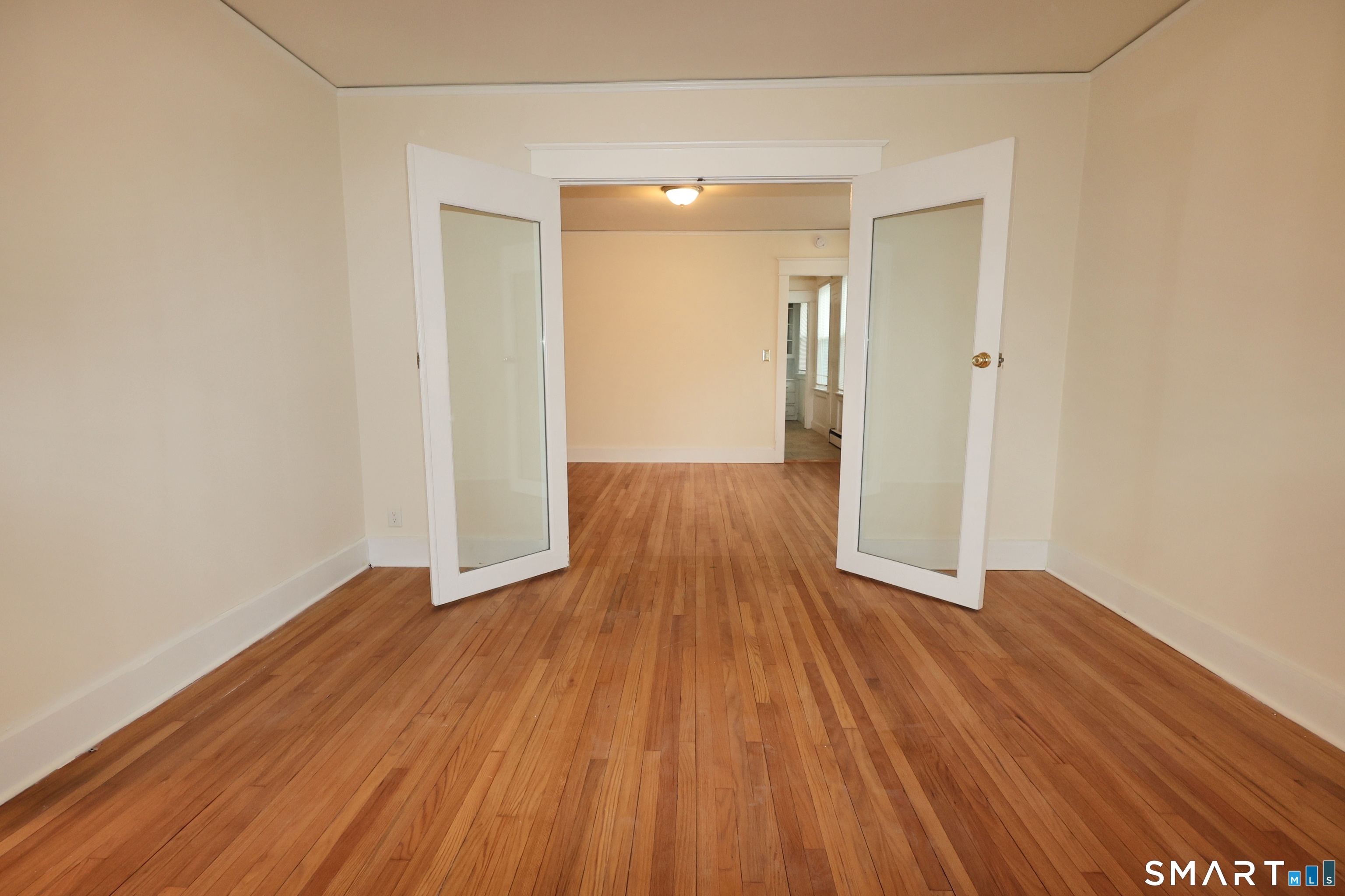 146 Division Street, Unit 1 Ansonia, CT 06401 - Photo 11 of 27 a view of wooden floor in an empty room