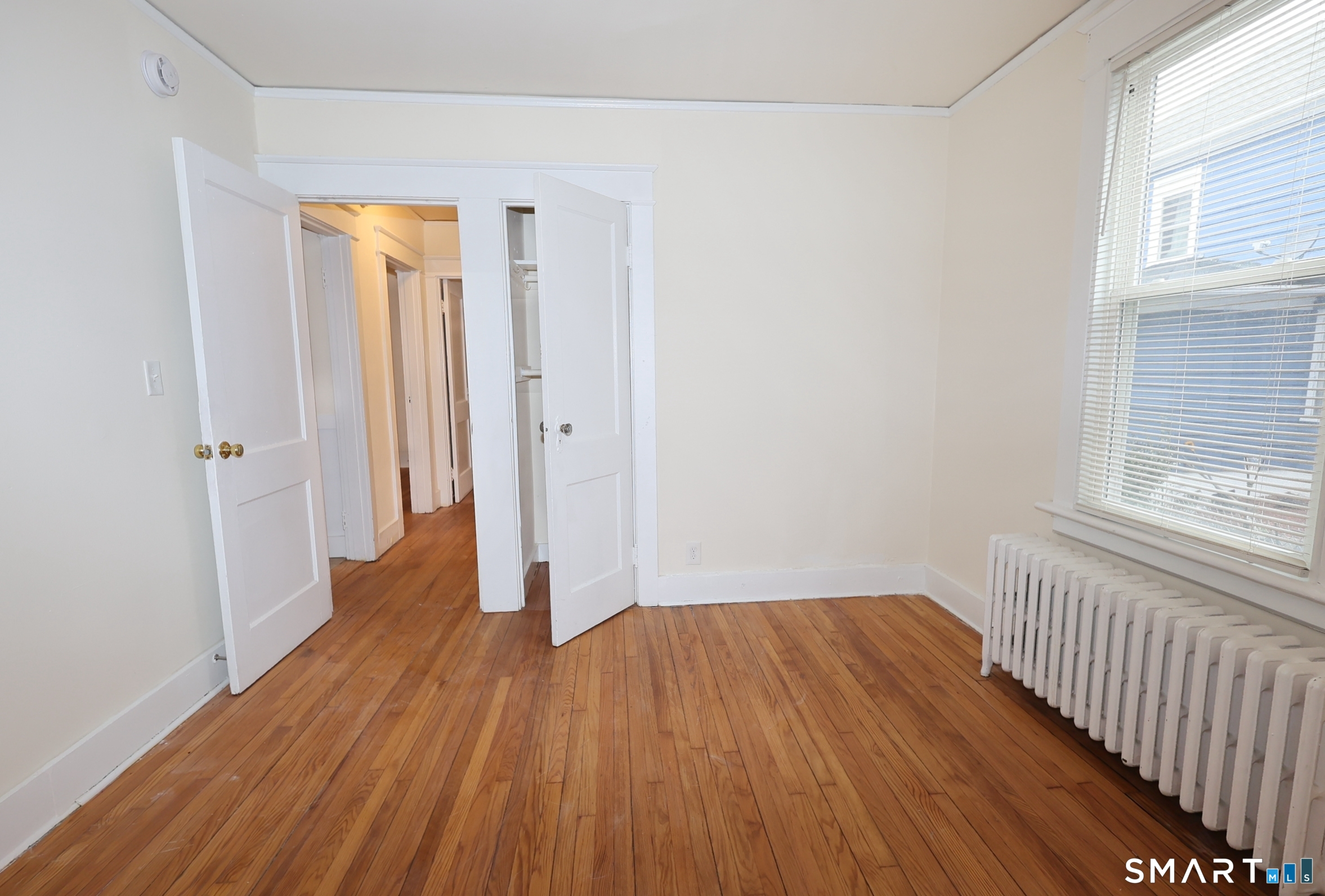 146 Division Street, Unit 1 Ansonia, CT 06401 - Photo 23 of 27 a view of a room with wooden floor and a window