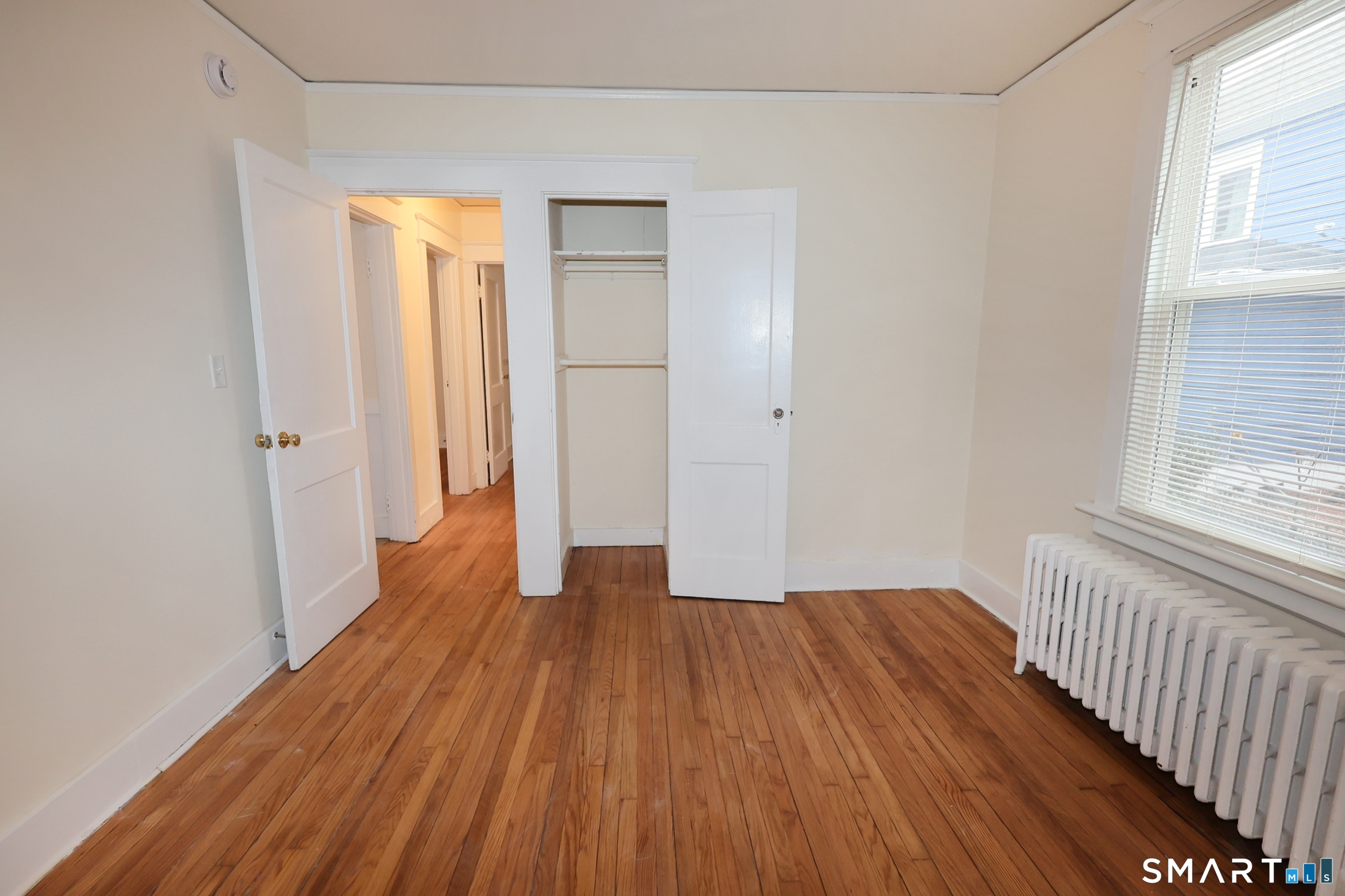 146 Division Street, Unit 1 Ansonia, CT 06401 - Photo 24 of 27 a view of a room with wooden floor and window