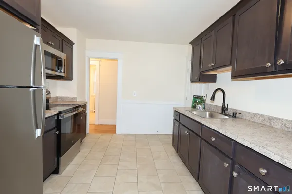 a kitchen with a sink and cabinets