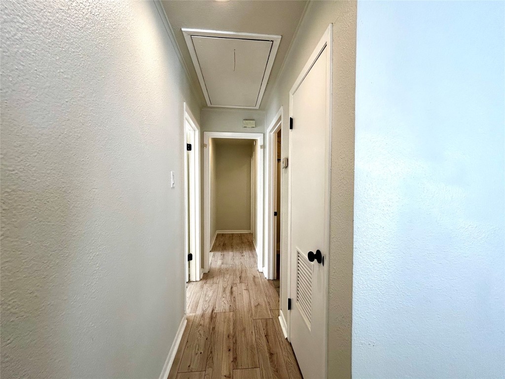 1005 West Martin Luther King Jr Boulevard, Unit B Austin, TX 78701 - Photo 15 of 29 a view of a hallway with wooden floor and staircase