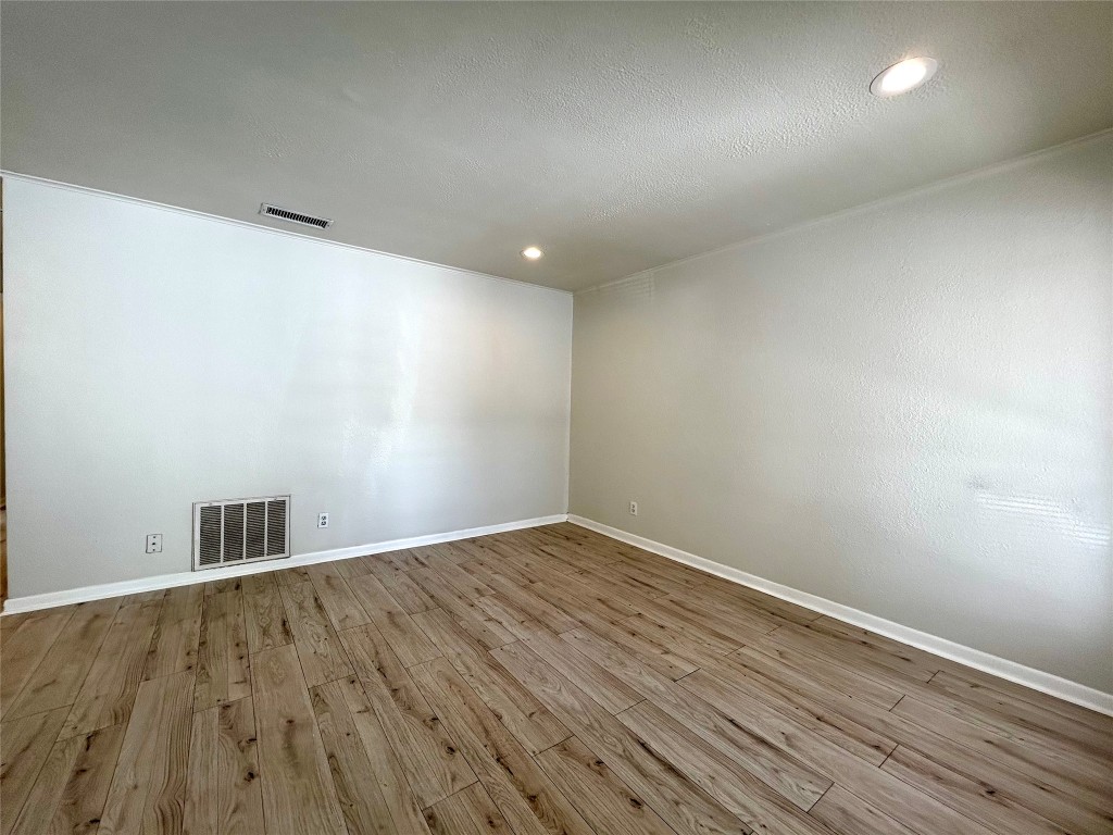 1005 West Martin Luther King Jr Boulevard, Unit B Austin, TX 78701 - Photo 4 of 29 a view of empty room with wooden floor