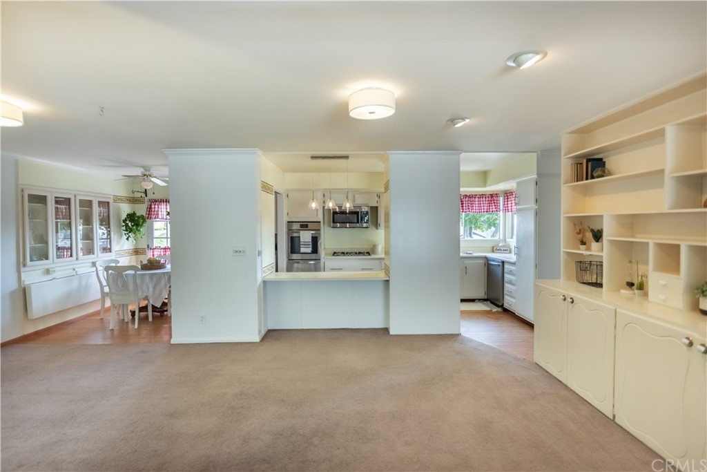 395 Pineridge Street Brea, CA 92821 - Photo 15 of 39 a view of a kitchen with furniture and a refrigerator