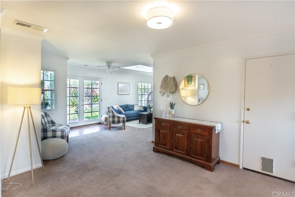 395 Pineridge Street Brea, CA 92821 - Photo 16 of 39 a living room with furniture a window and a chandelier