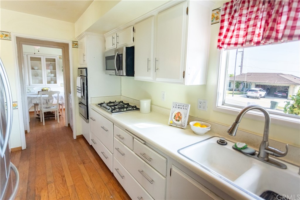 395 Pineridge Street Brea, CA 92821 - Photo 20 of 39 a kitchen with a sink appliances and cabinets