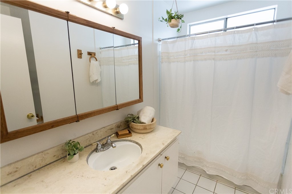 395 Pineridge Street Brea, CA 92821 - Photo 26 of 39 a bathroom with a sink and a mirror