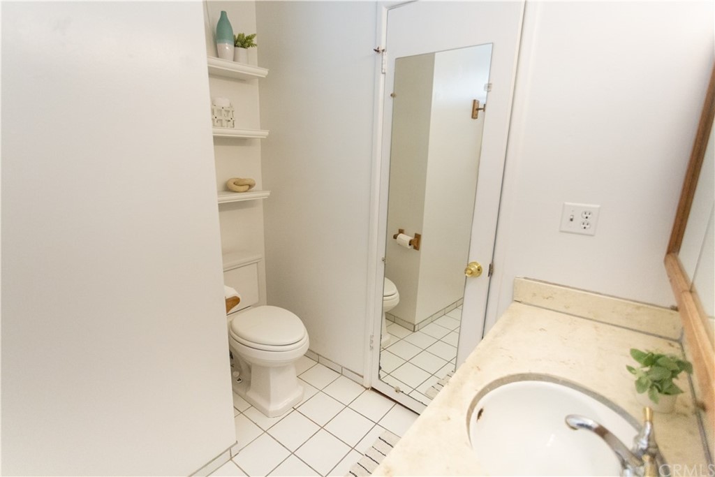 395 Pineridge Street Brea, CA 92821 - Photo 27 of 39 a bathroom with a granite countertop toilet and a sink