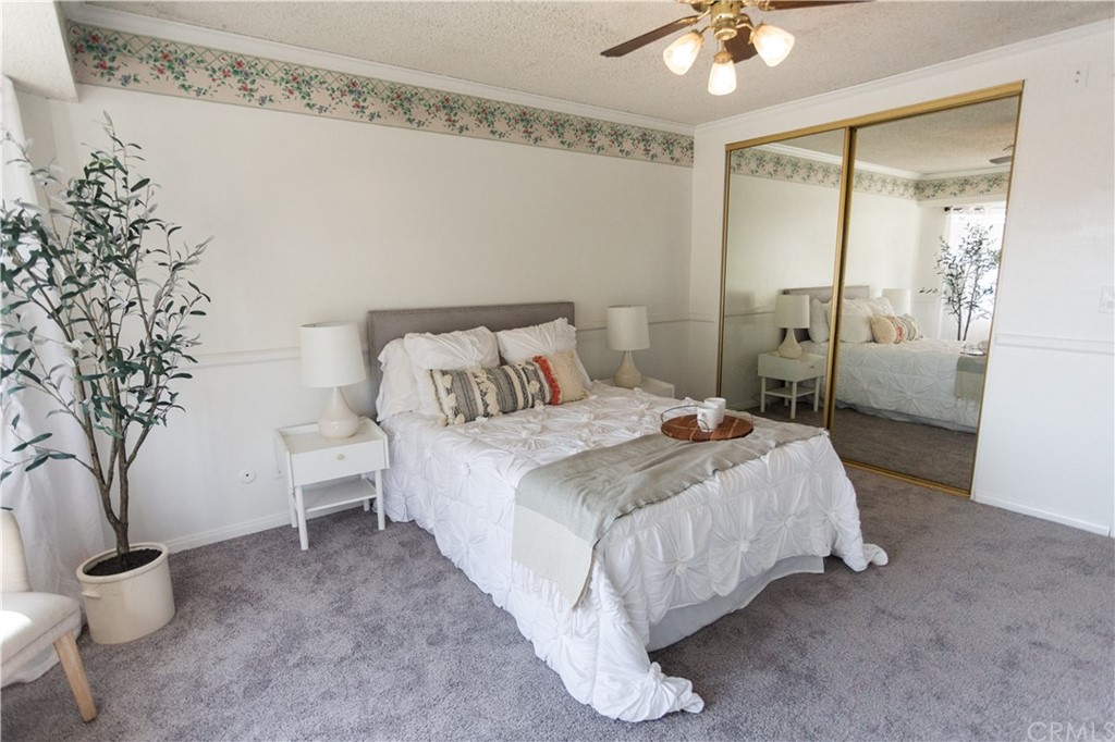395 Pineridge Street Brea, CA 92821 - Photo 33 of 39 a bedroom with a bed and a chandelier