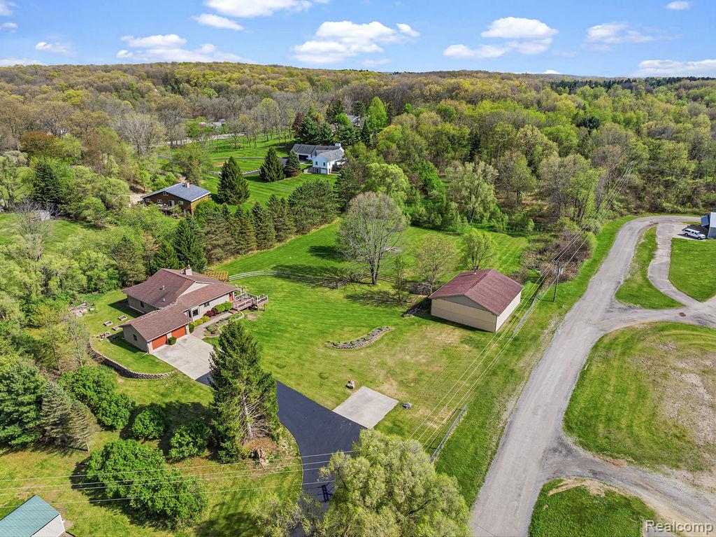 8742 Hyne Road Brighton, MI 48114 - Photo 58 of 65 Aerial view of a heavily wooded area