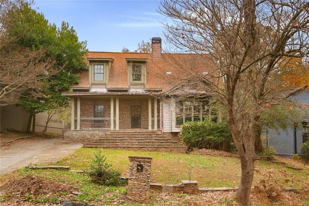 451 Hascall Road Northwest Atlanta, GA 30309 - Photo 2 of 26 a front view of a house with a yard