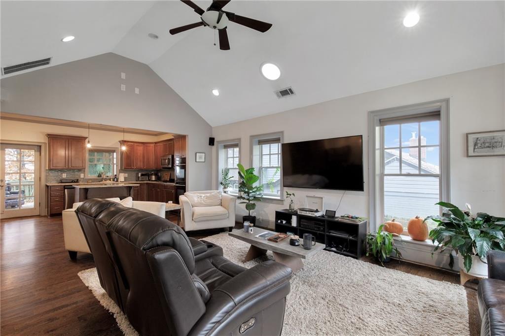 451 Hascall Road Northwest Atlanta, GA 30309 - Photo 4 of 26 a living room with furniture and a flat screen tv
