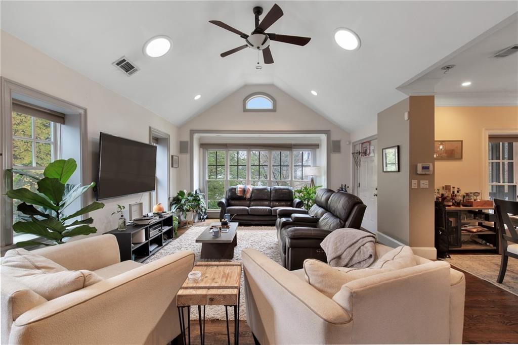451 Hascall Road Northwest Atlanta, GA 30309 - Photo 5 of 26 a living room with furniture ceiling fan and a large window