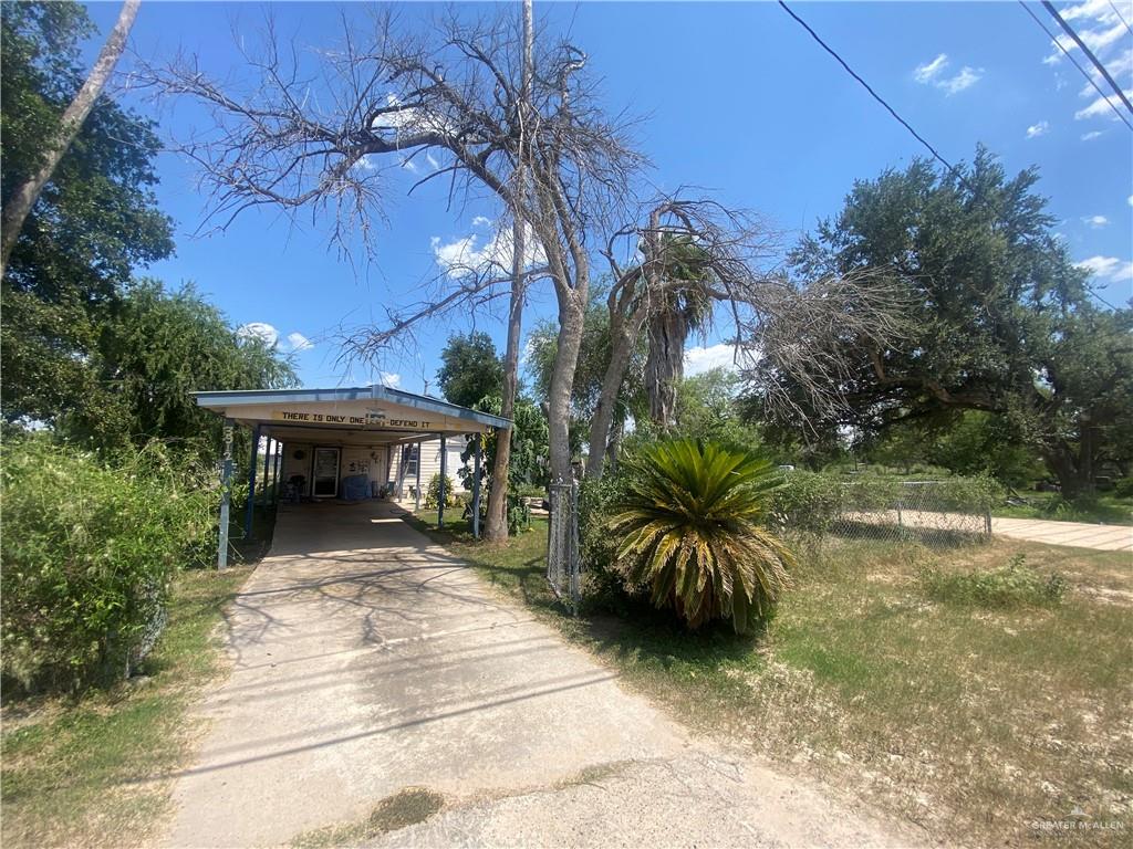 3912-3914 Los Ebanos Road Mission, TX 78573 - Photo 2 of 18 a view of a terrace with a garden and trees