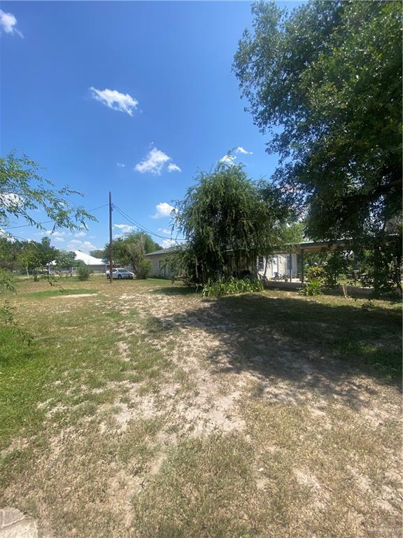 3912-3914 Los Ebanos Road Mission, TX 78573 - Photo 4 of 18 a view of a yard with an outdoor space