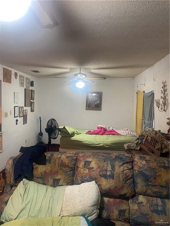 3912-3914 Los Ebanos Road Mission, TX 78573 - Photo 6 of 18 a room with a bed and gym equipment