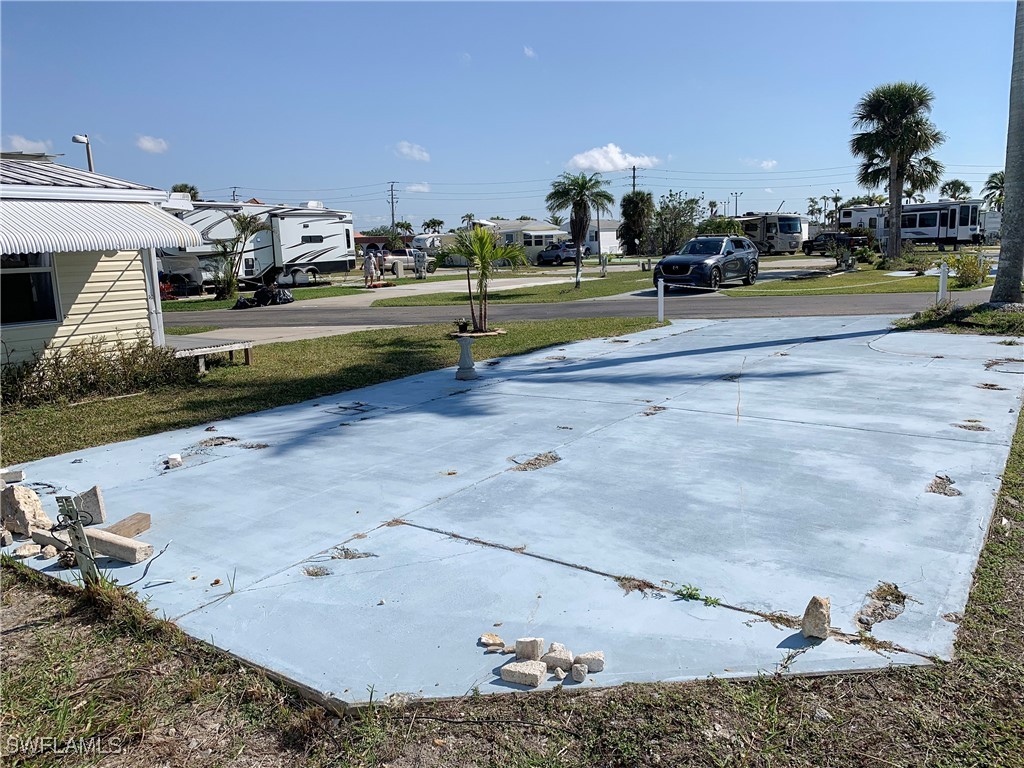 19681 Summerlin Road, Unit 225J Fort Myers, FL 33908 - Photo 2 of 6 a view of a yard in front of the house