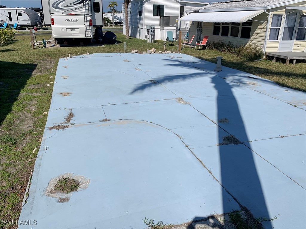 19681 Summerlin Road, Unit 225J Fort Myers, FL 33908 - Photo 3 of 6 a view of a street with cars