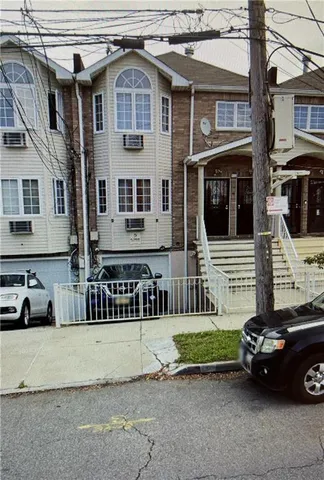 a view of a car parked in front of a house