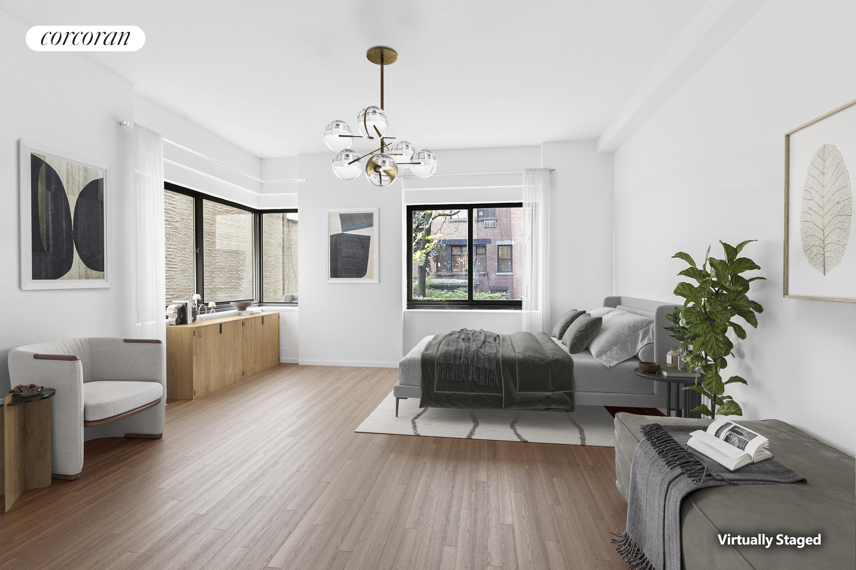 25 East 83rd Street, Unit 2E Manhattan, NY 10028 - Photo 17 of 19 a living room with furniture and a wooden floor