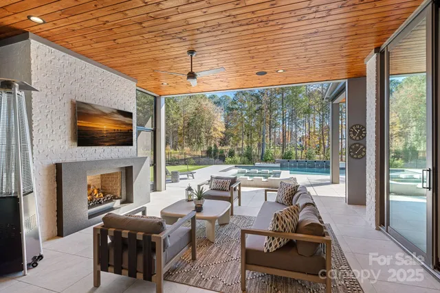 a bedroom with a bed couch and window