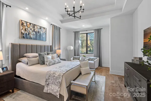 a spacious bedroom with a bed and a desk