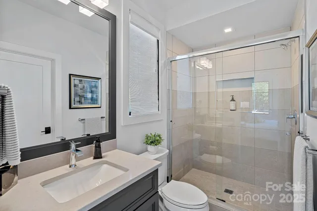 a outdoor space with couches and potted plants