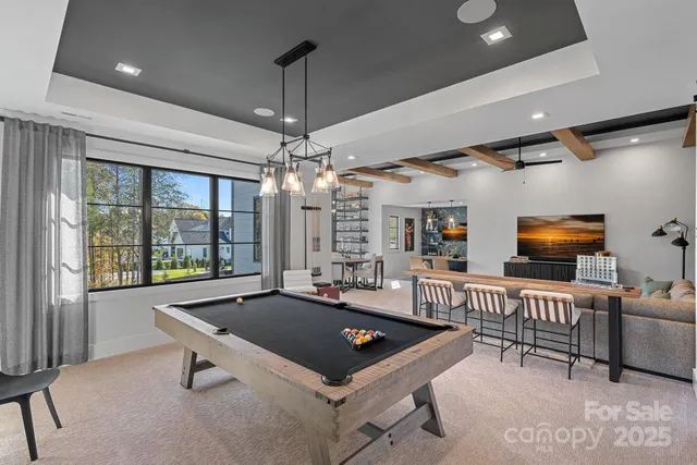 a front view of a residential houses with yard and swimming pool