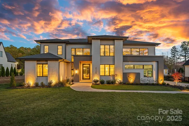 a view of an entryway with wooden floor and windows