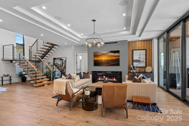 a large dining hall with stainless steel appliances granite countertop a coffee maker a table and chairs