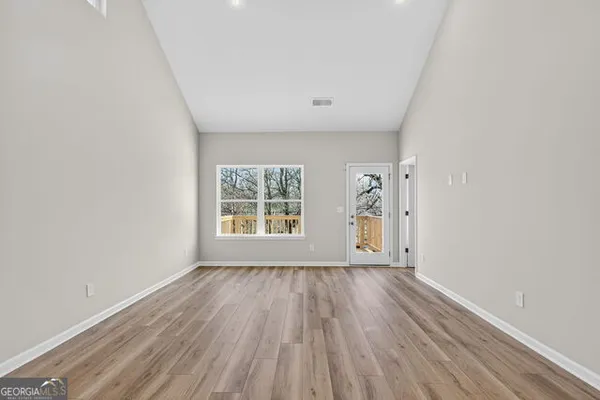 a view of a kitchen with a sink and a microwave