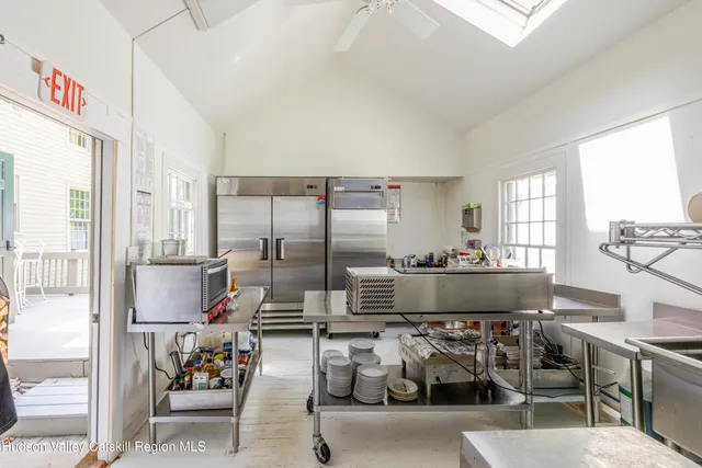a living room with fireplace furniture and a wooden floor