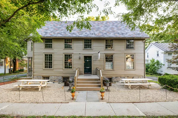 a front view of a house with garage