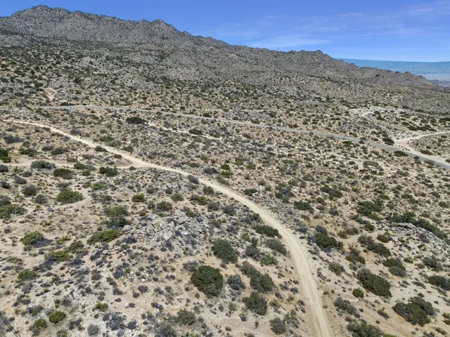 a view of a city with mountains in the background