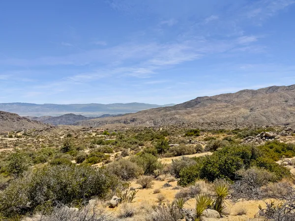 a view of a city with mountains in the background