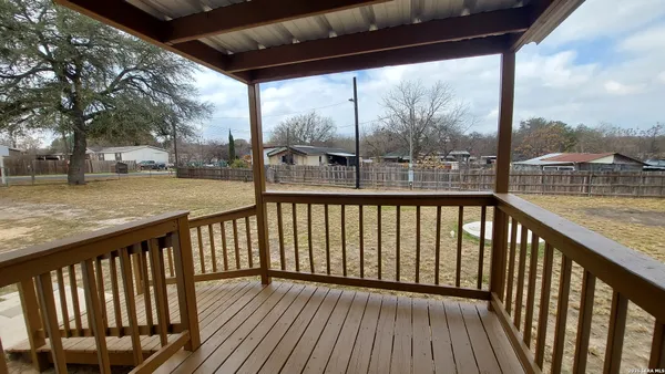 a view of balcony with wooden floor