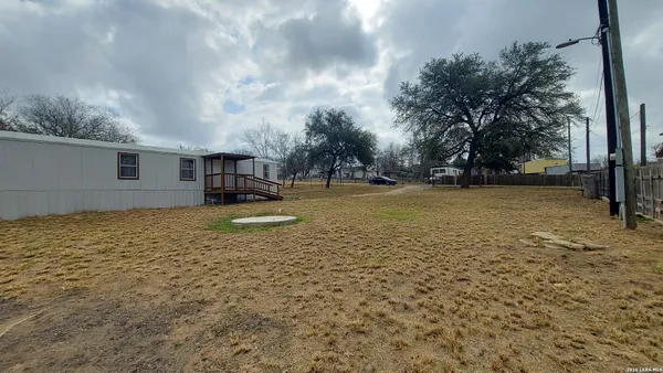a view of a patio with a yard