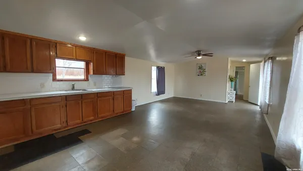 a view of a kitchen with a sink cabinets and a window